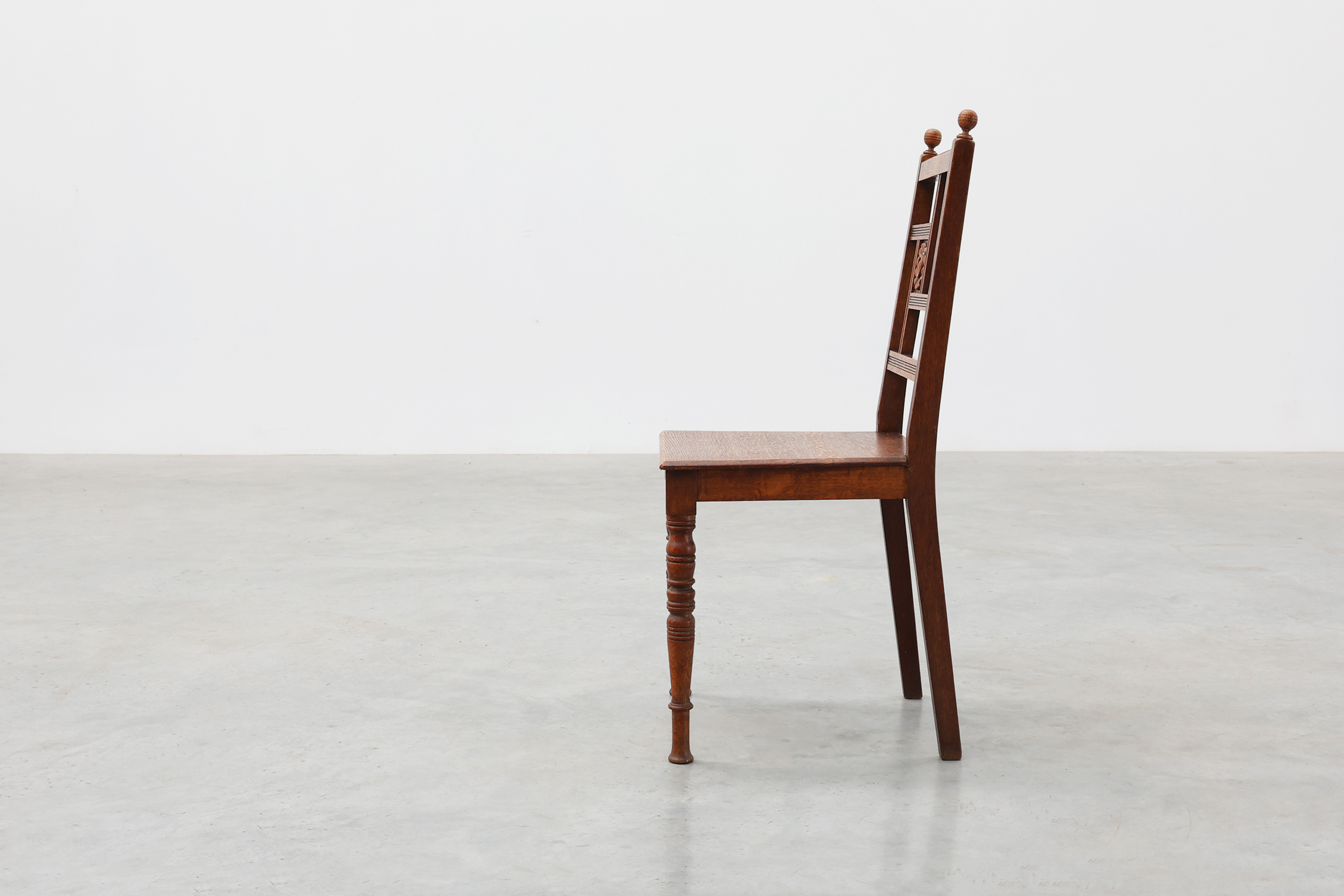 Art Deco oak side chair with carved rosette back and turned front legs, Belgium ca. 1915thumbnail